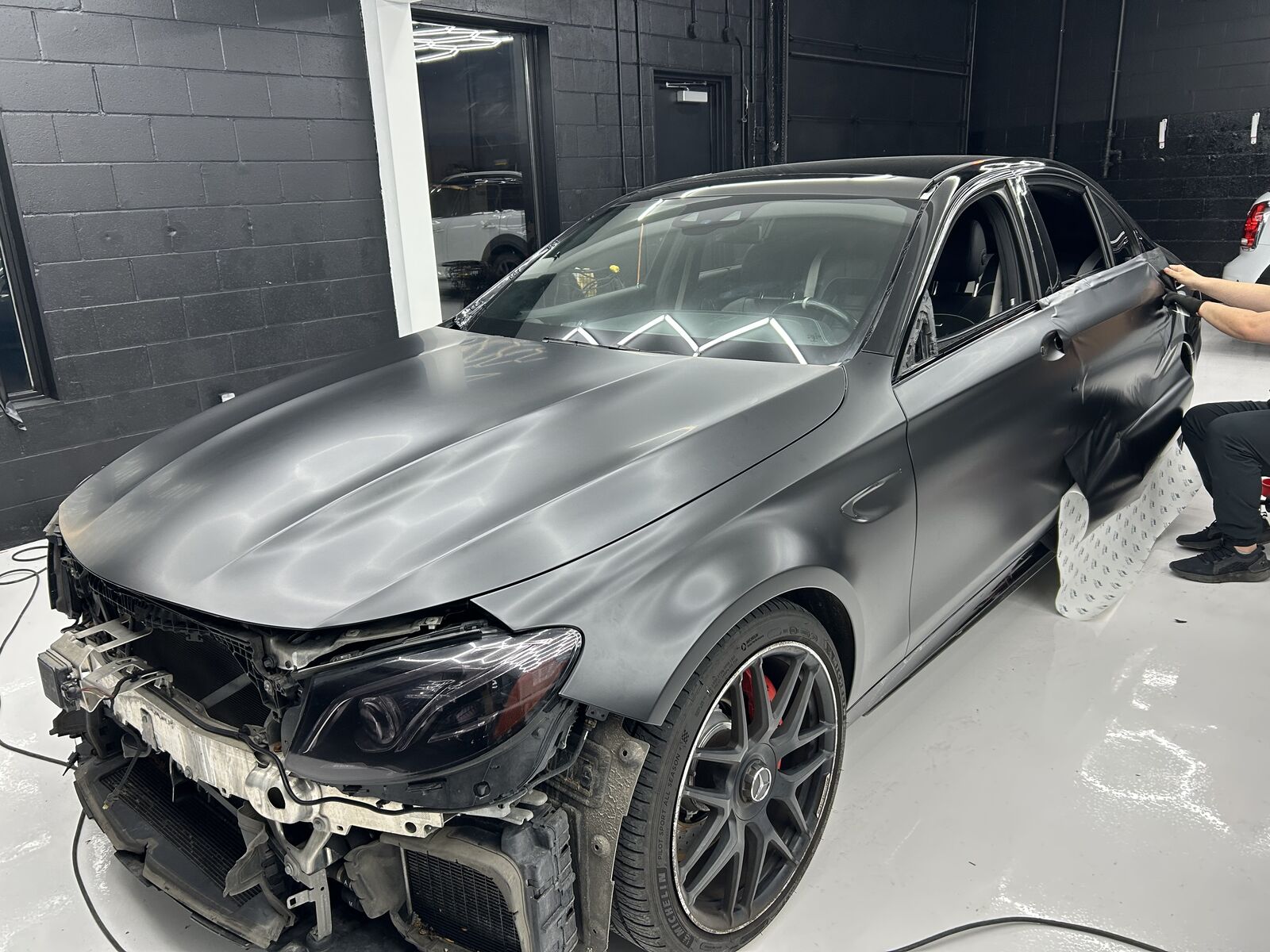 PPF installation work inside the Perfection Auto Spa studio